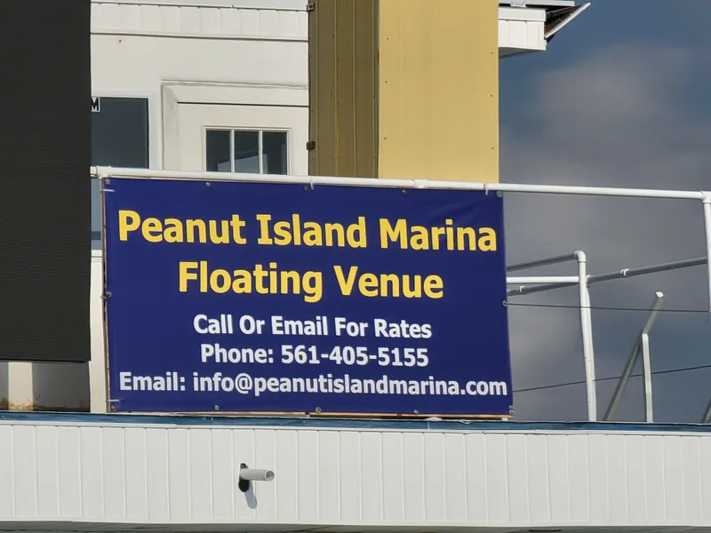 Slide: The Image of Peanut Island Marina floating venue sign with contact details for rates. - 9
