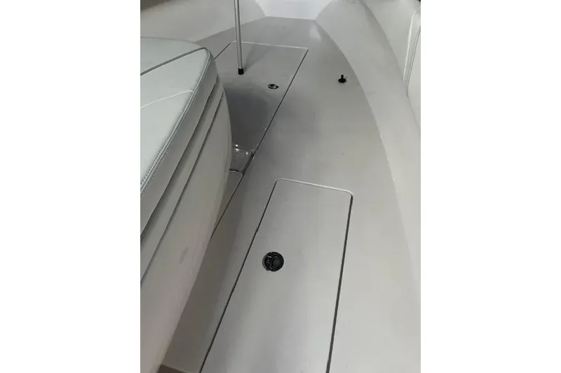 Slide: The Image of 2024 Contender 32 ST boat interior, featuring sleek seating and deck design. - 11
