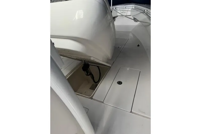 Slide: The Image of 2024 Contender 32 ST boat interior with storage compartments and sleek design. - 12