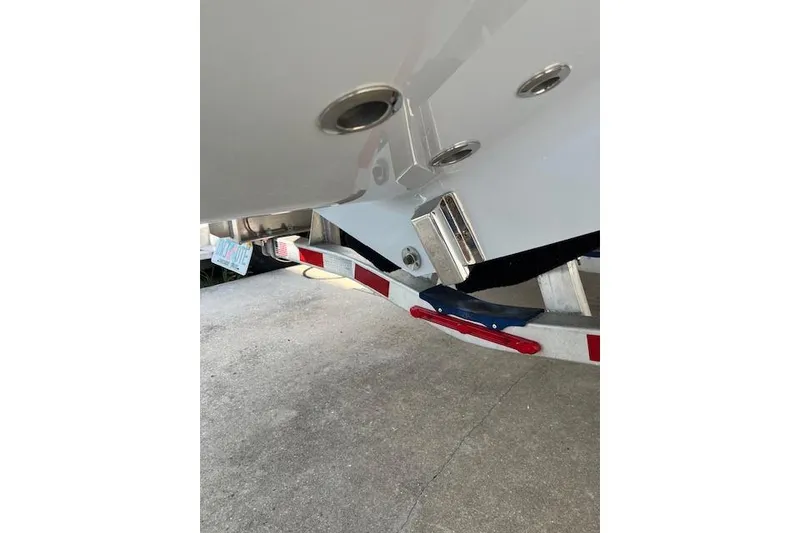 Slide: The Image of 2024 Contender 32 ST boat on trailer, showing hull and fittings. - 15