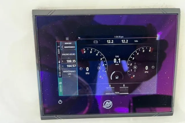 Slide: The Image of 2024 Contender 32 ST dashboard display showing engine hours and voltage readings. - 19
