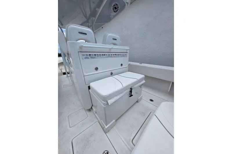 Slide: The Image of 2024 Contender 32 ST boat interior with seating and storage compartments. - 29
