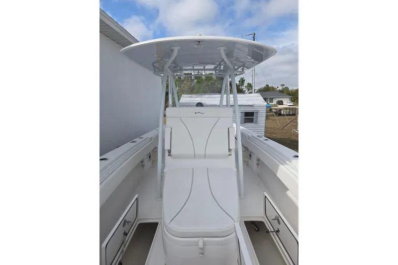 Slide: The Image of 2024 Contender 32 ST boat interior with seating and storage compartments. - 33