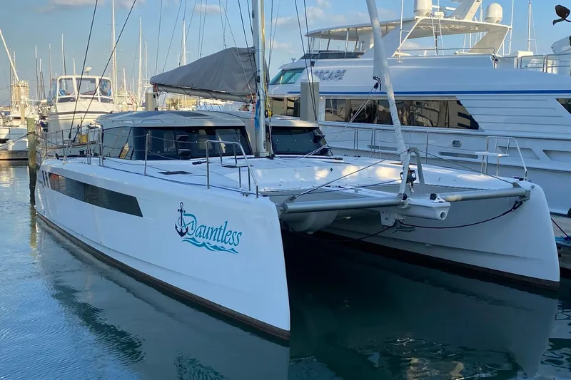 The Image of 2024 Seawind 1370 catamaran docked in marina, featuring sleek design and modern amenities. - 0