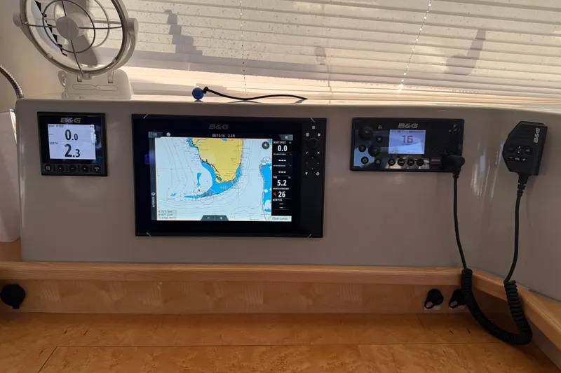 Slide: The Image of 2024 Seawind 1370 navigation panel with B&G instruments and chart display. - 13