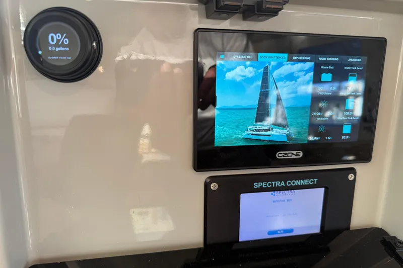 Slide: The Image of Control panel of 2024 Seawind 1370 catamaran with digital displays and sailing interface. - 14