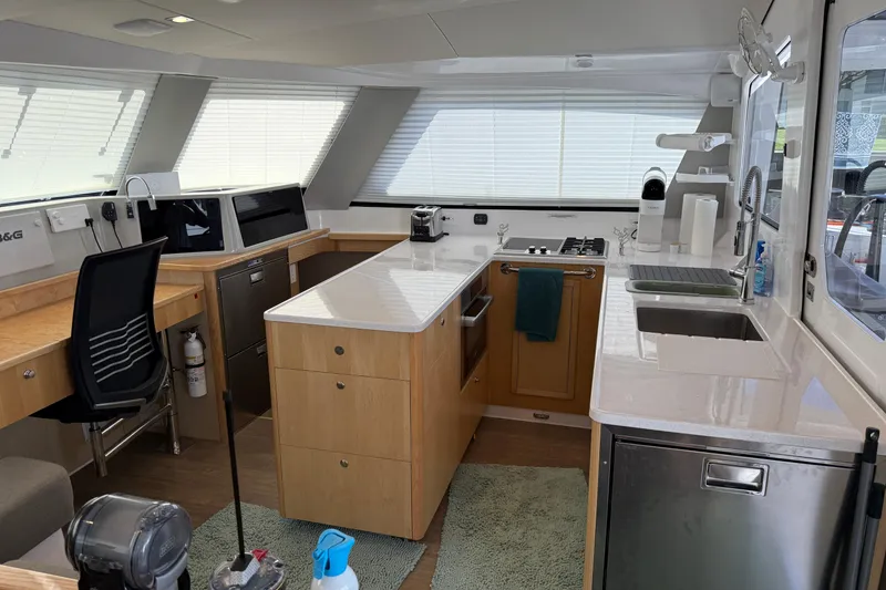 Slide: The Image of Modern kitchen interior of 2024 Seawind 1370 yacht with sleek design and appliances. - 16
