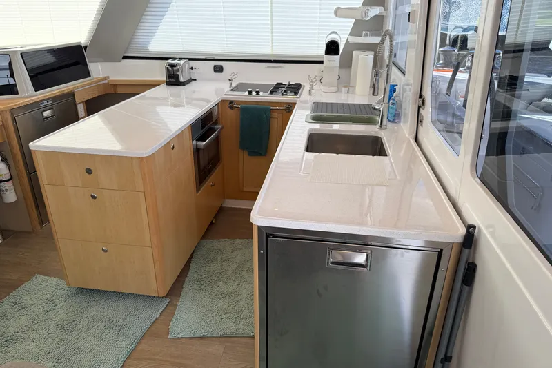 Slide: The Image of Modern kitchen interior of 2024 Seawind 1370 yacht with sleek countertops and appliances. - 17