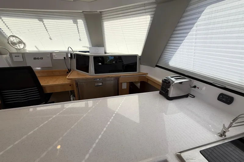 Slide: The Image of Modern kitchen interior of 2024 Seawind 1370 yacht with appliances and sleek design. - 18