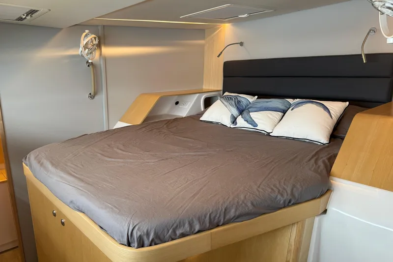 Slide: The Image of Luxurious bedroom interior of 2024 Seawind 1370 yacht with modern design and cozy bedding. - 25