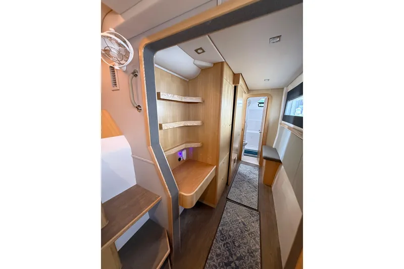 Slide: The Image of 2024 Seawind 1370 yacht interior with modern wood finish and sleek design. - 30