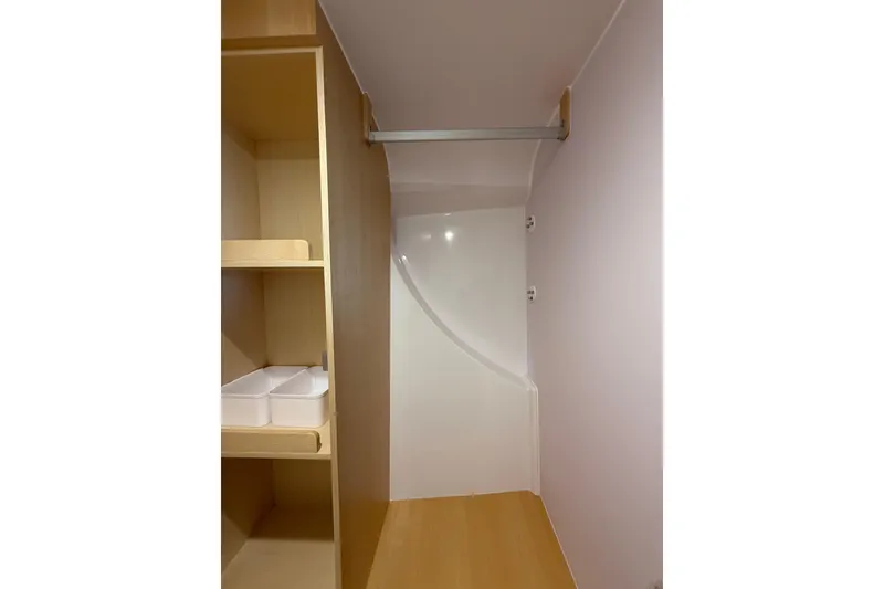 Slide: The Image of 2024 Seawind 1370 interior closet with shelving and hanging rod. - 37