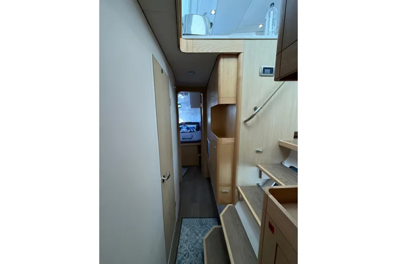 Slide: The Image of Interior of 2024 Seawind 1370 yacht, featuring modern wood finishes and compact design. - 47