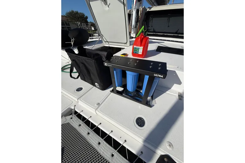 Slide: The Image of 2024 Seawind 1370 deck with water filtration system and fuel container. - 58