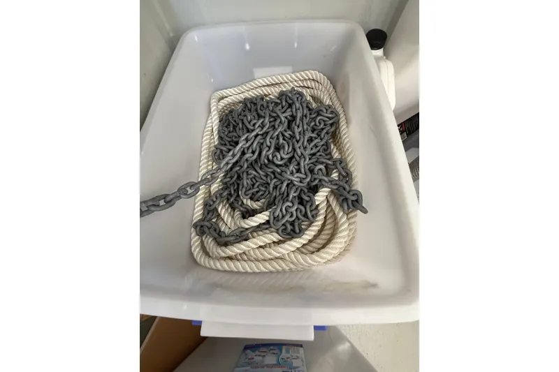 Slide: The Image of Rope and chain in a container on a 2024 Seawind 1370 boat. - 62