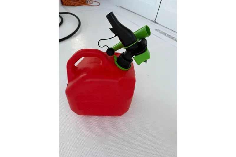 Slide: The Image of Red fuel container with green spout on Seawind 1370, 2024 model. - 73