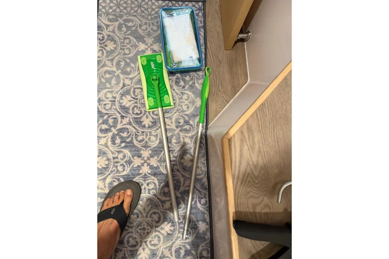 Slide: The Image of Cleaning tools on patterned carpet in Seawind 1370, 2024 model. - 74