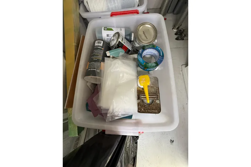 Slide: The Image of Storage bin with assorted supplies on a 2024 Seawind 1370 yacht. - 77