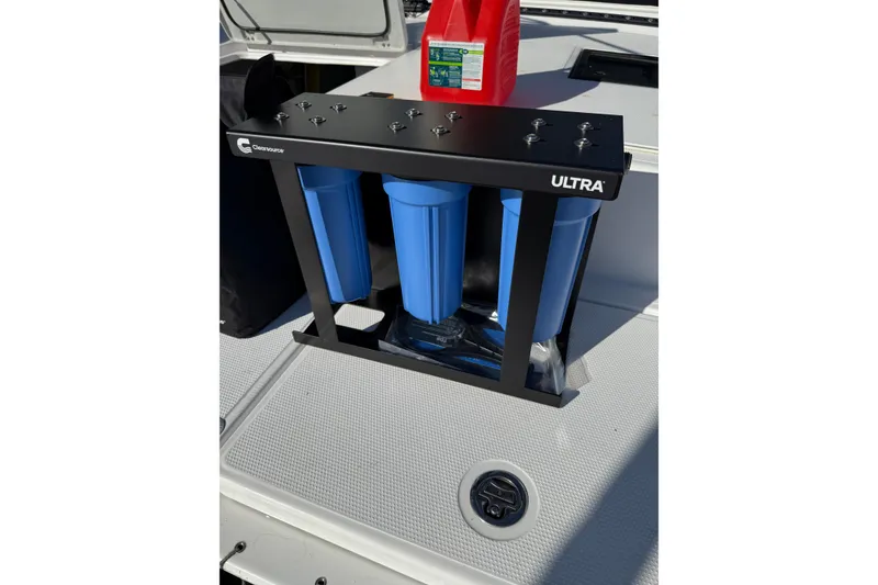 Slide: The Image of Water filtration system on 2024 Seawind 1370 boat deck with red container. - 79