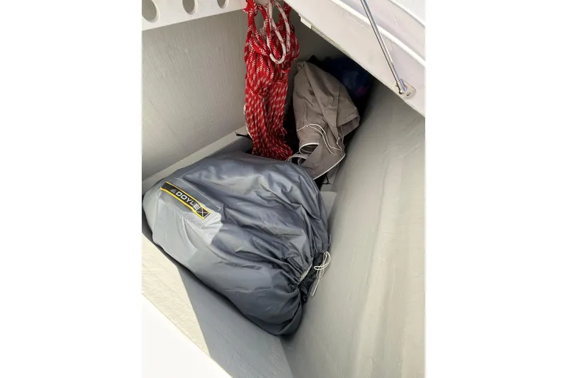 Slide: The Image of Storage compartment on 2024 Seawind 1370 yacht with ropes and sail bag. - 82