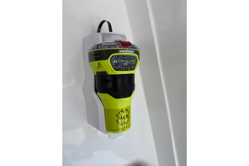 Slide: The Image of Emergency beacon on 2024 Seawind 1370 yacht, mounted on white surface. - 89