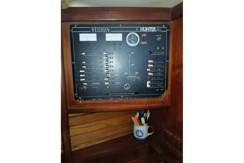 Slide: The Image of Control panel of a 1993 Hunter Vision 36 sailboat, with switches and gauges. - 19