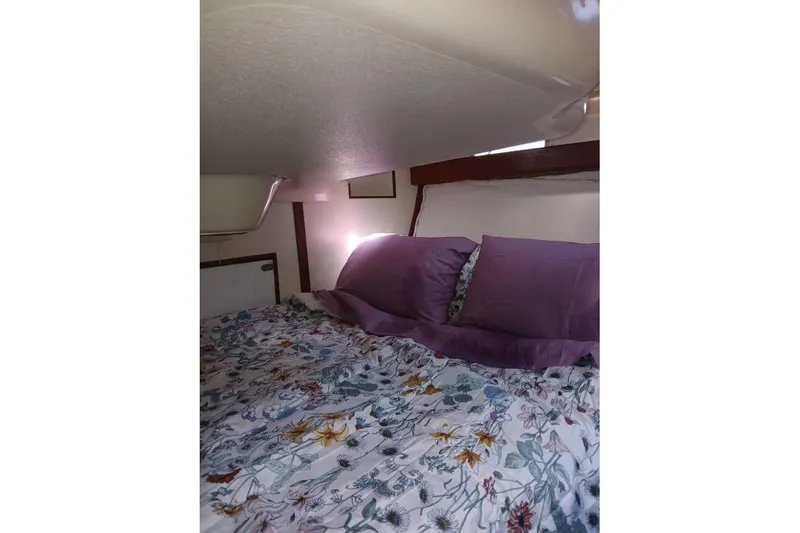 Slide: The Image of Cozy cabin bed with floral bedding in 1993 Hunter Vision 36 sailboat. - 20