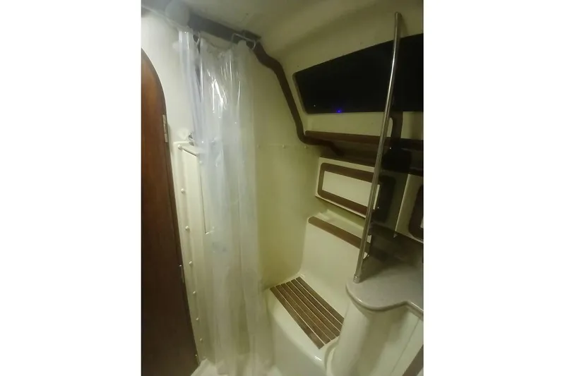 Slide: The Image of Interior of 1993 Hunter Vision 36 sailboat bathroom with shower and seating area. - 23