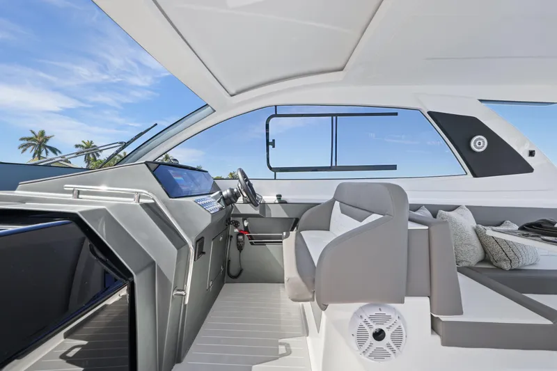 Slide: The Image of Interior of 2026 Valiatt 380 Bowrider boat with modern seating and dashboard. - 6