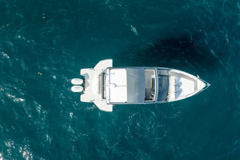 Slide: The Image of Aerial view of 2026 Valiatt 380 Bowrider on clear blue water. - 7