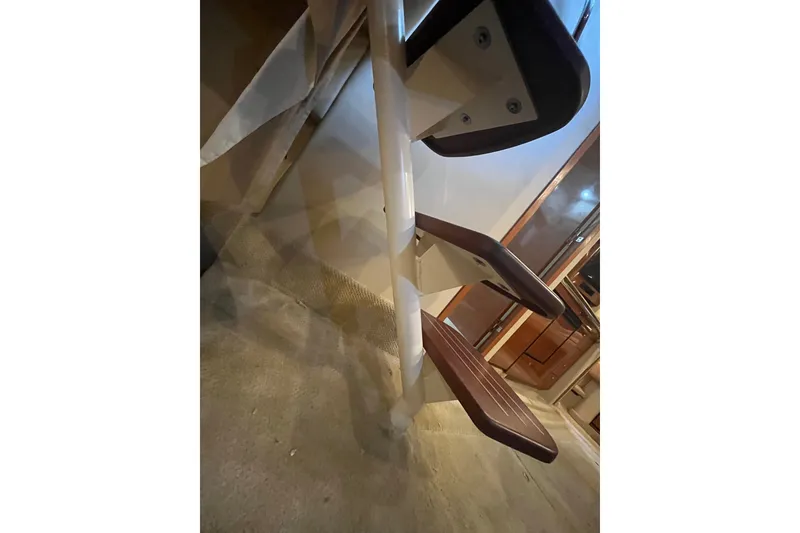 Slide: The Image of Kitchen sink and faucet in 2005 Sea Ray 360 Sundancer boat, granite countertop. - 23