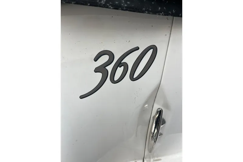 Slide: The Image of Close-up of 2005 Sea Ray 360 Sundancer emblem on white surface. - 4
