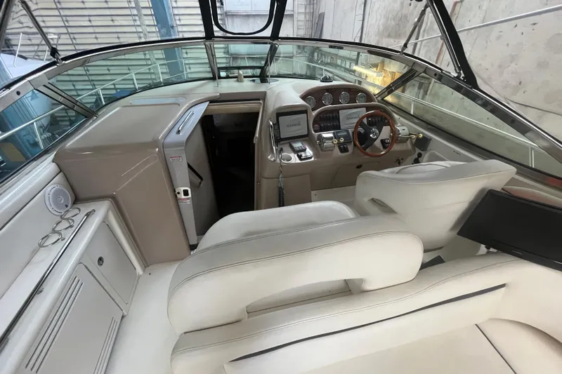 Slide: The Image of 2005 Sea Ray 360 Sundancer cockpit with modern navigation equipment and luxurious seating. - 7