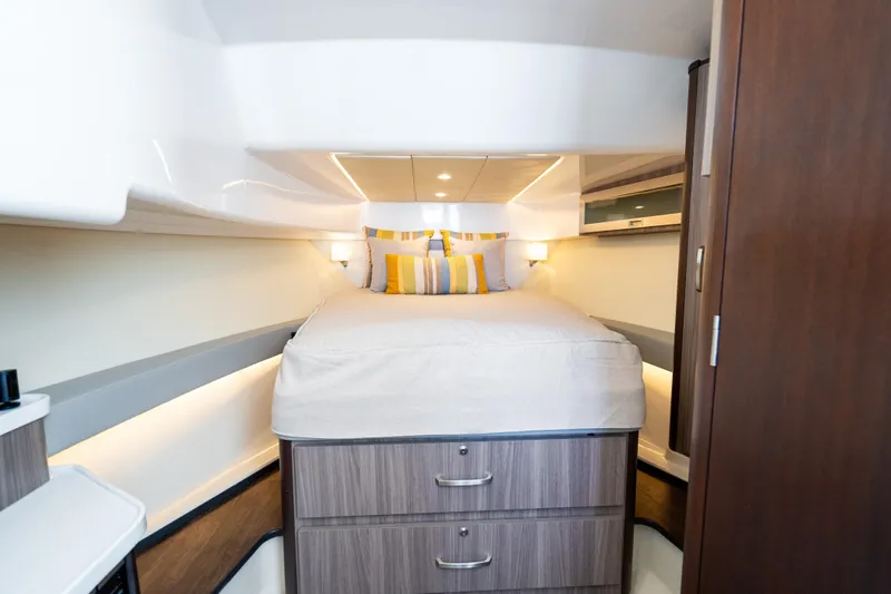 Slide: The Image of Interior cabin of 2022 Regal 36 Grande Coupe with cozy bed and modern design. - 19