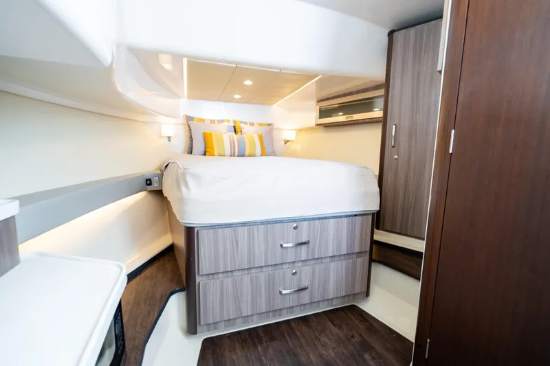Slide: The Image of Luxurious cabin interior of 2022 Regal 36 Grande Coupe yacht with modern furnishings. - 20