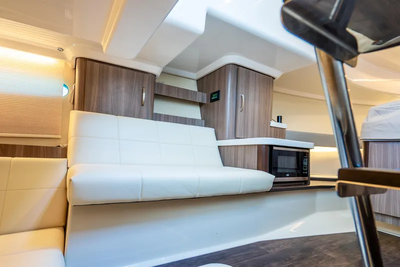 Slide: The Image of Interior of 2022 Regal 36 Grande Coupe with modern seating and cabinetry. - 29