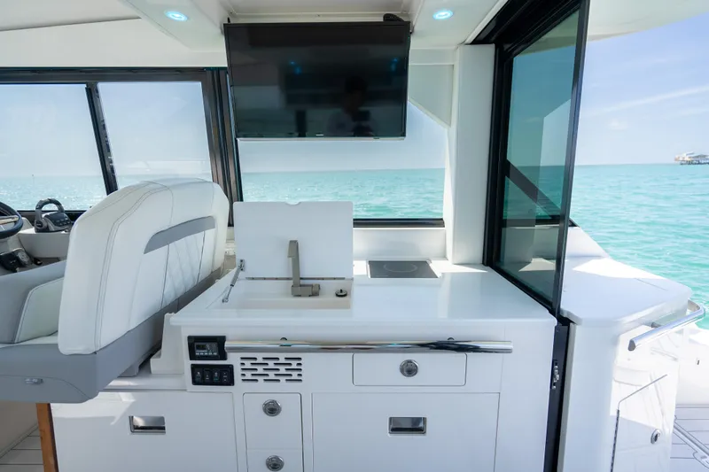 Slide: The Image of Interior of 2022 Regal 36 Grande Coupe yacht with modern amenities and ocean view. - 3