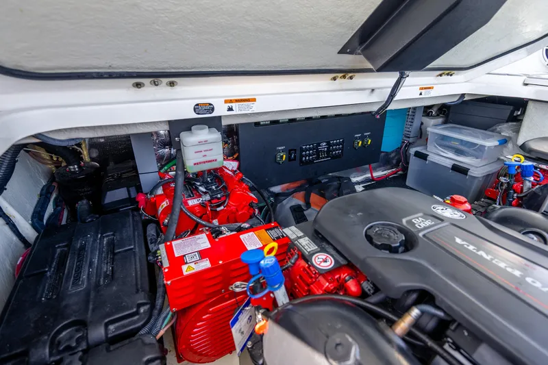 Slide: The Image of Engine compartment of 2022 Regal 36 Grande Coupe with visible components and wiring. - 61