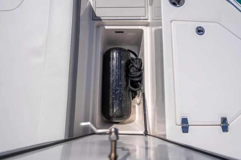 Slide: The Image of Storage compartment on 2022 Regal 36 Grande Coupe with fender and rope. - 66