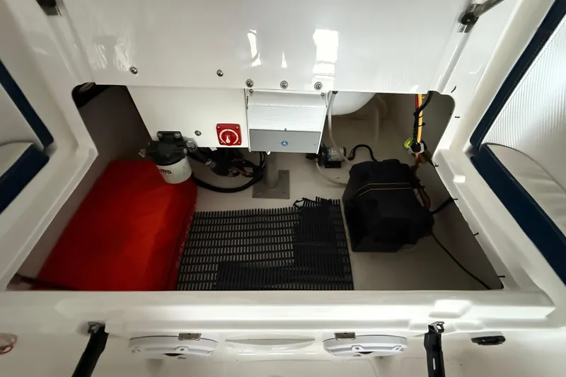 Slide: The Image of 2023 AB Inflatables Nautilus 17 DLX engine compartment with equipment and wiring. - 10