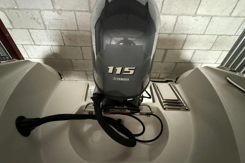 Slide: The Image of 2023 AB Inflatables Nautilus 17 DLX with Yamaha 115 outboard motor in storage. - 11