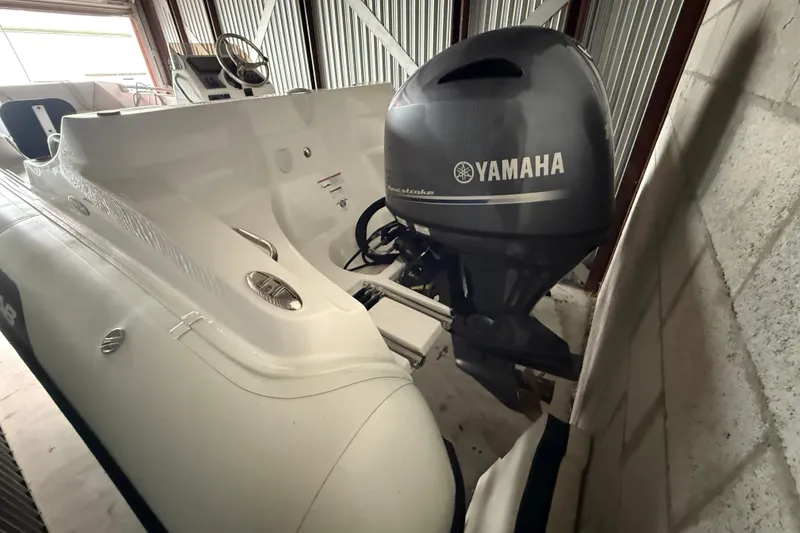 Slide: The Image of 2023 AB Inflatables Nautilus 17 DLX with Yamaha outboard engine in storage. - 15