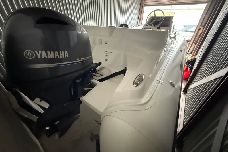 Slide: The Image of 2023 AB Inflatables Nautilus 17 DLX with Yamaha engine in storage unit. - 16
