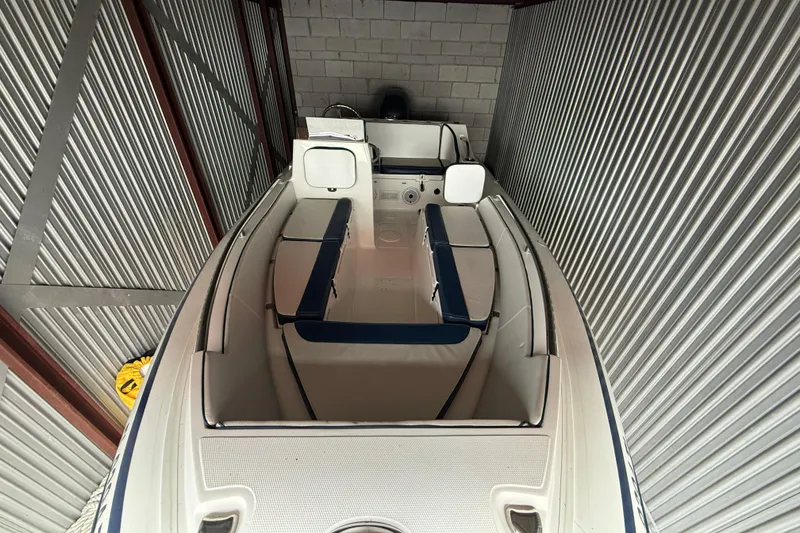 Slide: The Image of 2023 AB Inflatables Nautilus 17 DLX boat in storage, showcasing interior seating and design. - 4