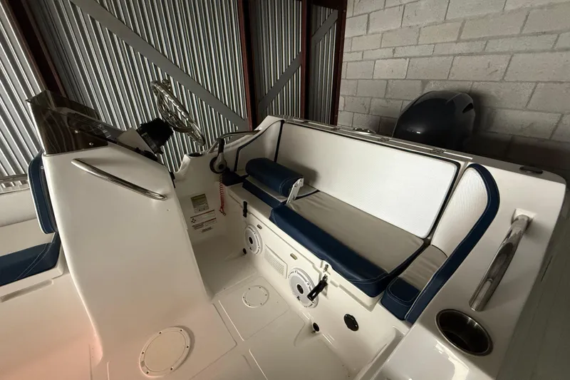 Slide: The Image of 2023 AB Inflatables Nautilus 17 DLX boat interior with seating and steering wheel. - 5