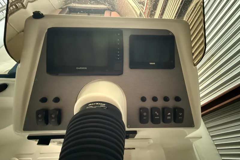 Slide: The Image of 2023 AB Inflatables Nautilus 17 DLX dashboard with Garmin and Yamaha displays. - 6