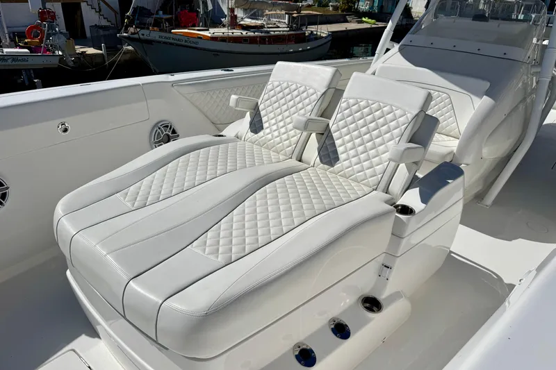 Slide: The Image of Luxurious seating on 2024 Intrepid 407 Nomad FE boat with quilted white upholstery. - 15