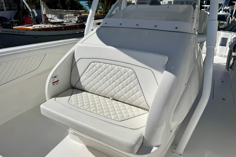 Slide: The Image of 2024 Intrepid 407 Nomad FE boat with white quilted seating detail. - 16