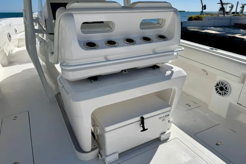 Slide: The Image of 2024 Intrepid 407 Nomad FE boat interior with seating and storage compartments. - 30