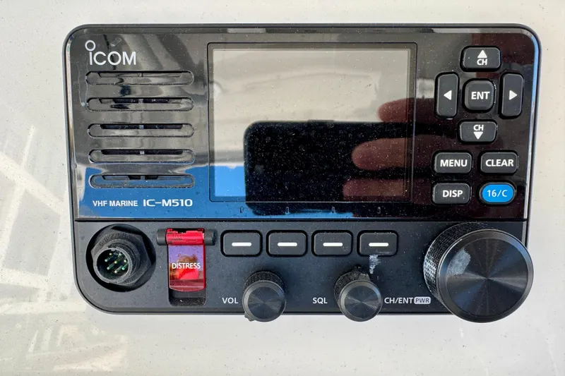 Slide: The Image of VHF Marine IC-M510 radio on 2024 Intrepid 407 Nomad FE boat dashboard. - 34